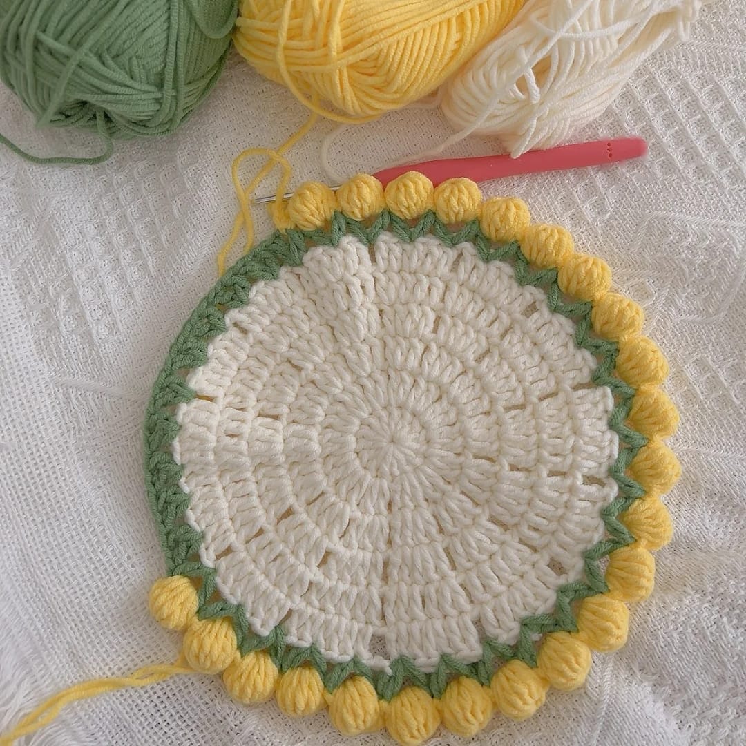 Crochet tulip bouquet coaster — finished piece with bobble flower edges